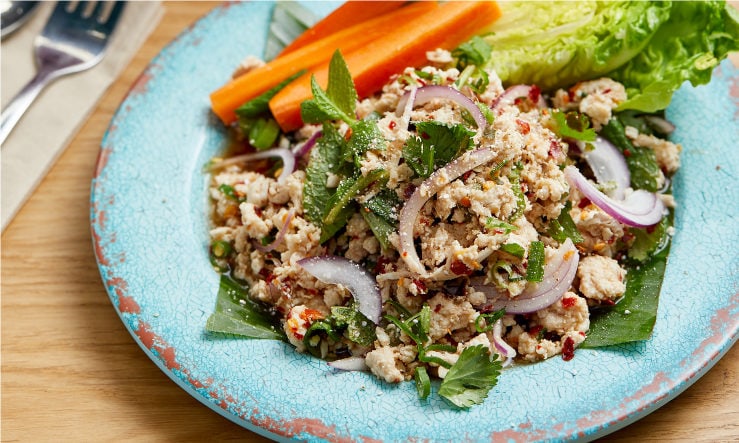 Rosa's Thai larb salad served on a pale blue plate
