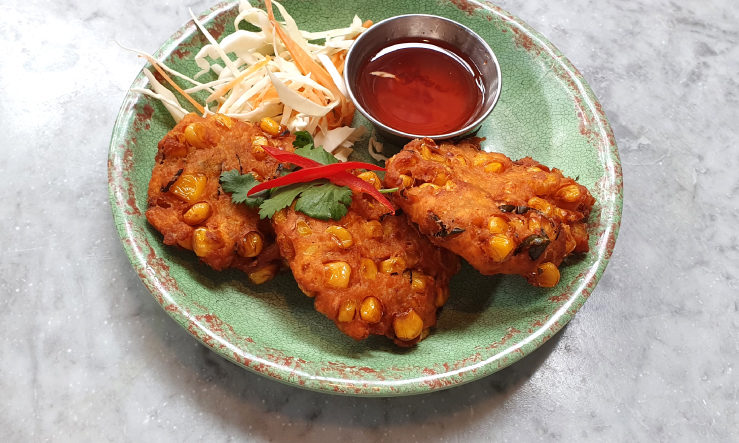 Rosa's Thai sweetcorn patties Sweetcorn Patties served on green plate