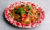Rosa's Thai drunken noodles served on a red mottled plate