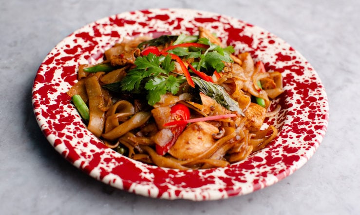 Rosa's Thai drunken noodles served on a red mottled plate