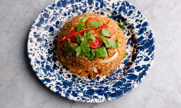 Perfect dome of Rosas'a Thai Fried Rice served on a mottled blue plate