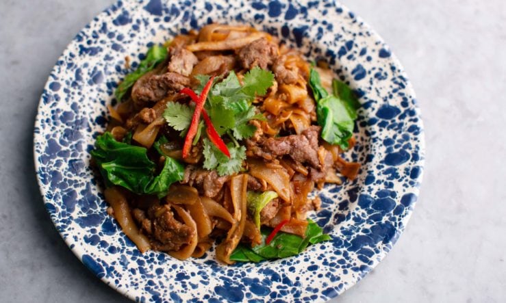 Rosa's Thai Drunken Noodles served on a blue and white plate