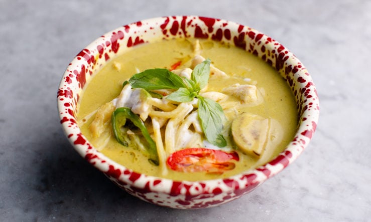 Rosa's Thai green curry green curry served in a red mottled bowl