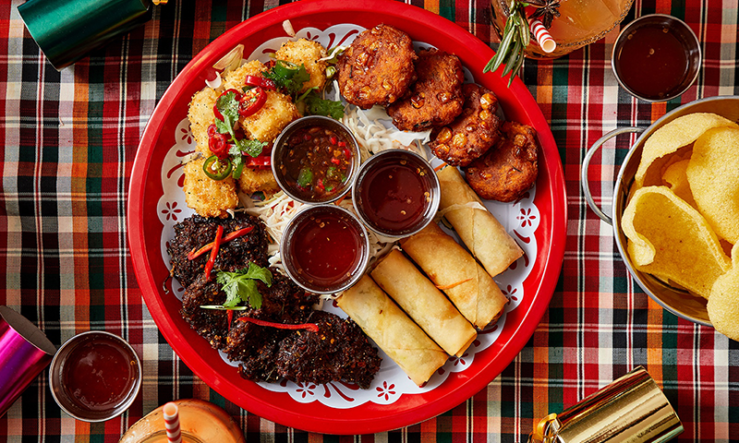 Rosa's Thai veggie Christmas platter on a tartan cloth with festive crackers