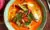 Thai red curry served in a green bowl