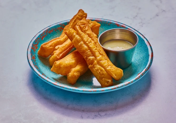 fried dough on blue plate