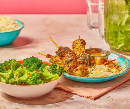 Chicken satay skewers and broccoli 