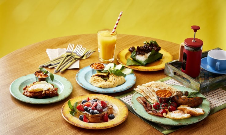 Rosa's Thai Brunch Landscape 002 Thai breakfast spread in colourful plates with yellow background