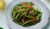 Thai green beans and chilli stir fry on grey plate