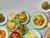 Thai food spread served on colourful plates